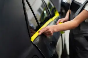 A technical comparison by Black Feather Accessories showing 3M Crystalline vs Nano Ceramic vs Carbon car tint performance in UAE heat.